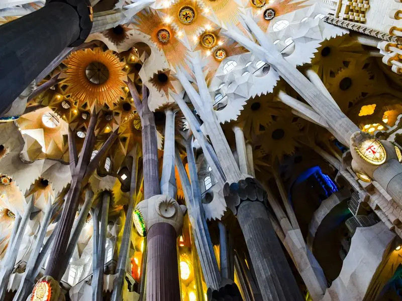 Tree-like columns and carved ceiling inside the Sagrada Família in Barcelona