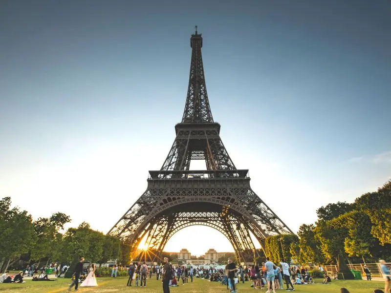 The Eiffel Tower at sunset seen from the Champ de Mars